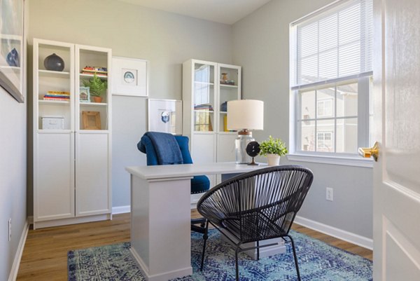 Modern home office with ergonomic desk and lamp in HeatherGate at Oxford Valley Apartments