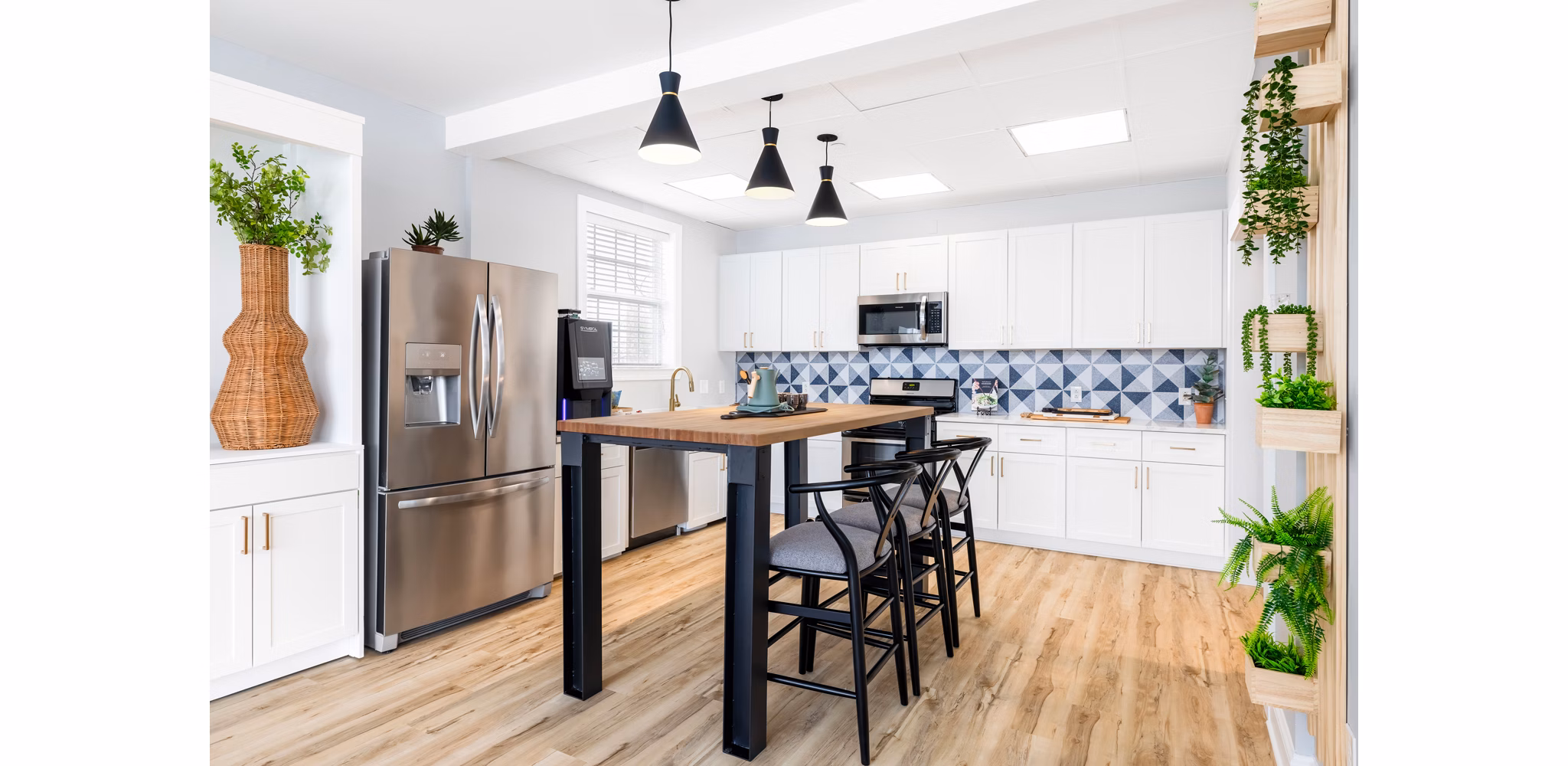 Modern kitchen with stainless steel appliances at HeatherGate at Oxford Valley Apartments