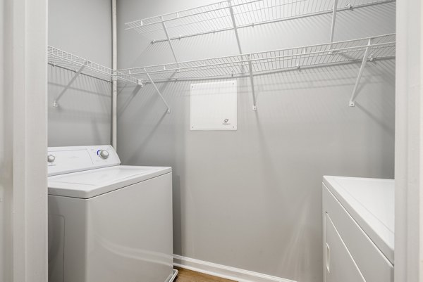 Laundry room with modern appliances at HeatherGate at Oxford Valley Apartments