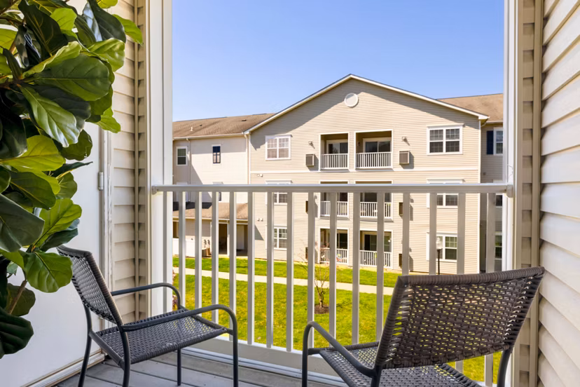Inviting patio with seating area at HeatherGate at Oxford Valley Apartments, ideal for outdoor relaxation and social gatherings