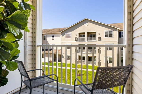 Inviting patio with seating area at HeatherGate at Oxford Valley Apartments, ideal for outdoor relaxation and social gatherings