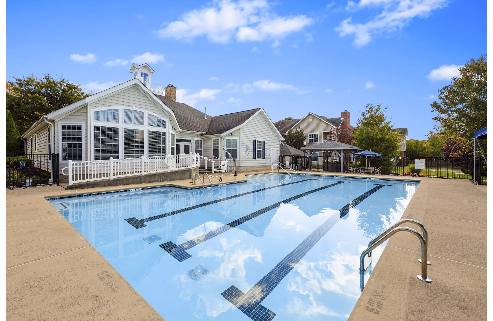 Resort-style pool with spacious sundeck at HeatherGate at Oxford Valley Apartments offering luxury living