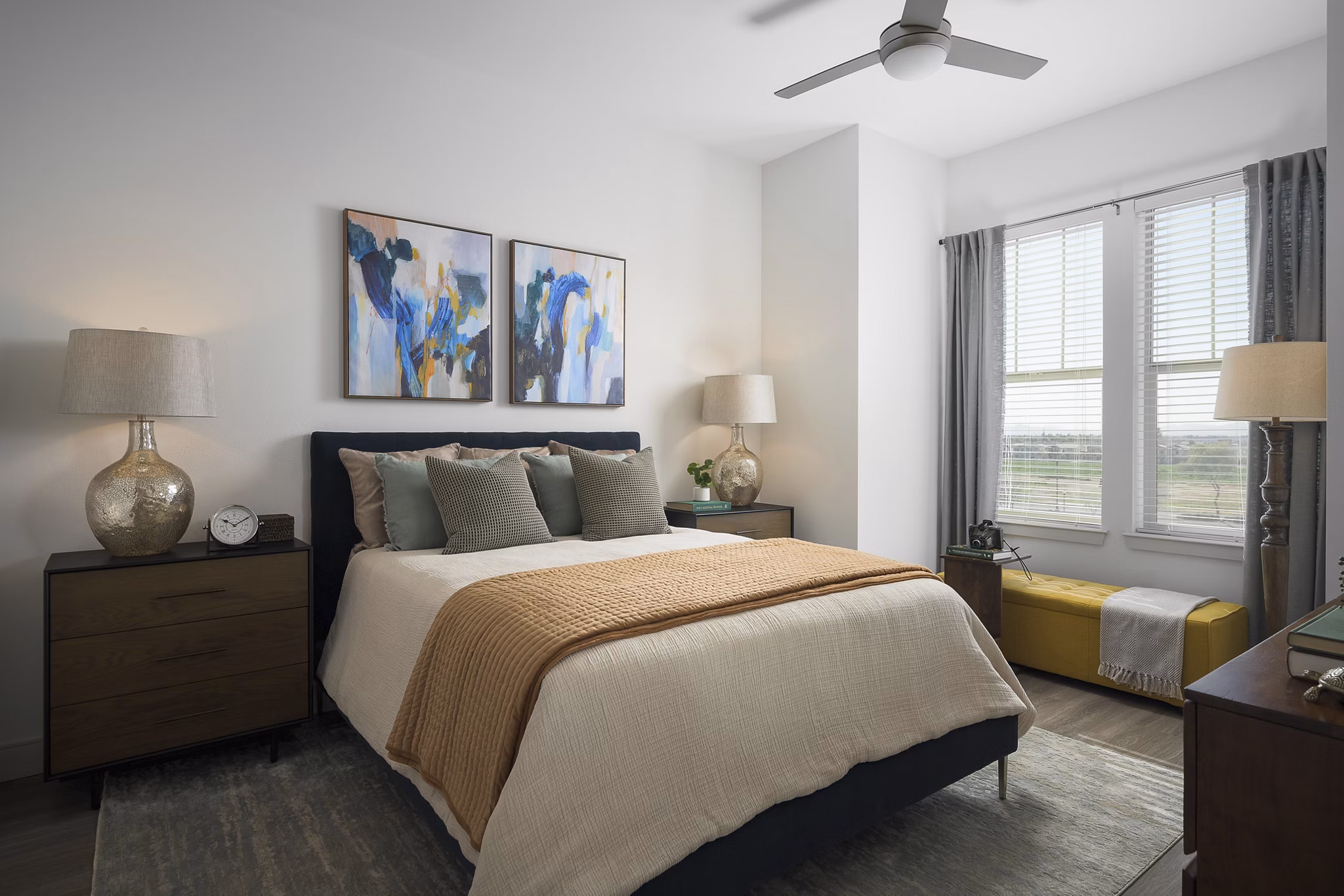 Cozy bedroom with modern decor at The Tyler Apartments, a luxury Greystar community