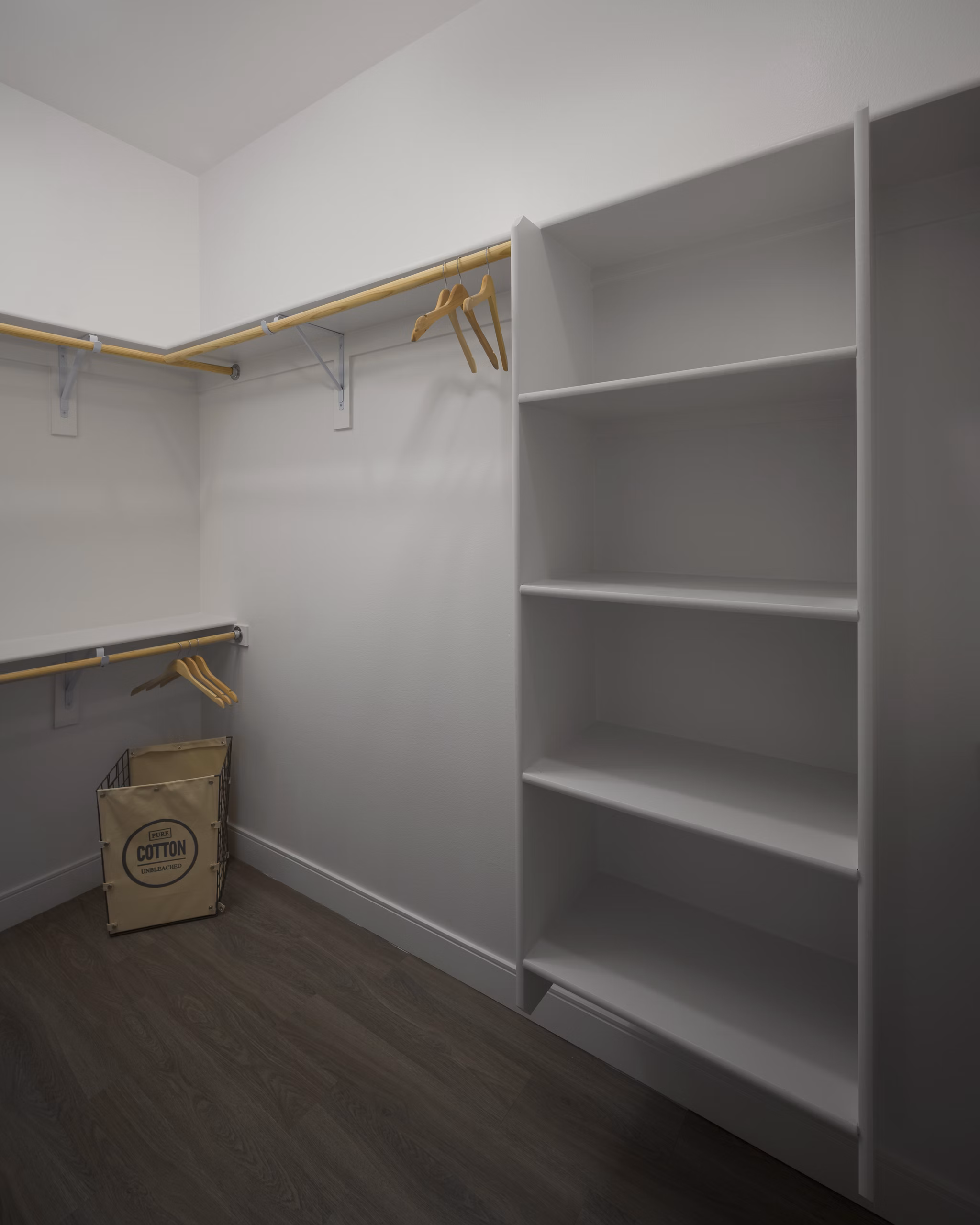 Spacious walk-in closet with built-in shelving at The Tyler Apartments, luxury living space for Greystar residents