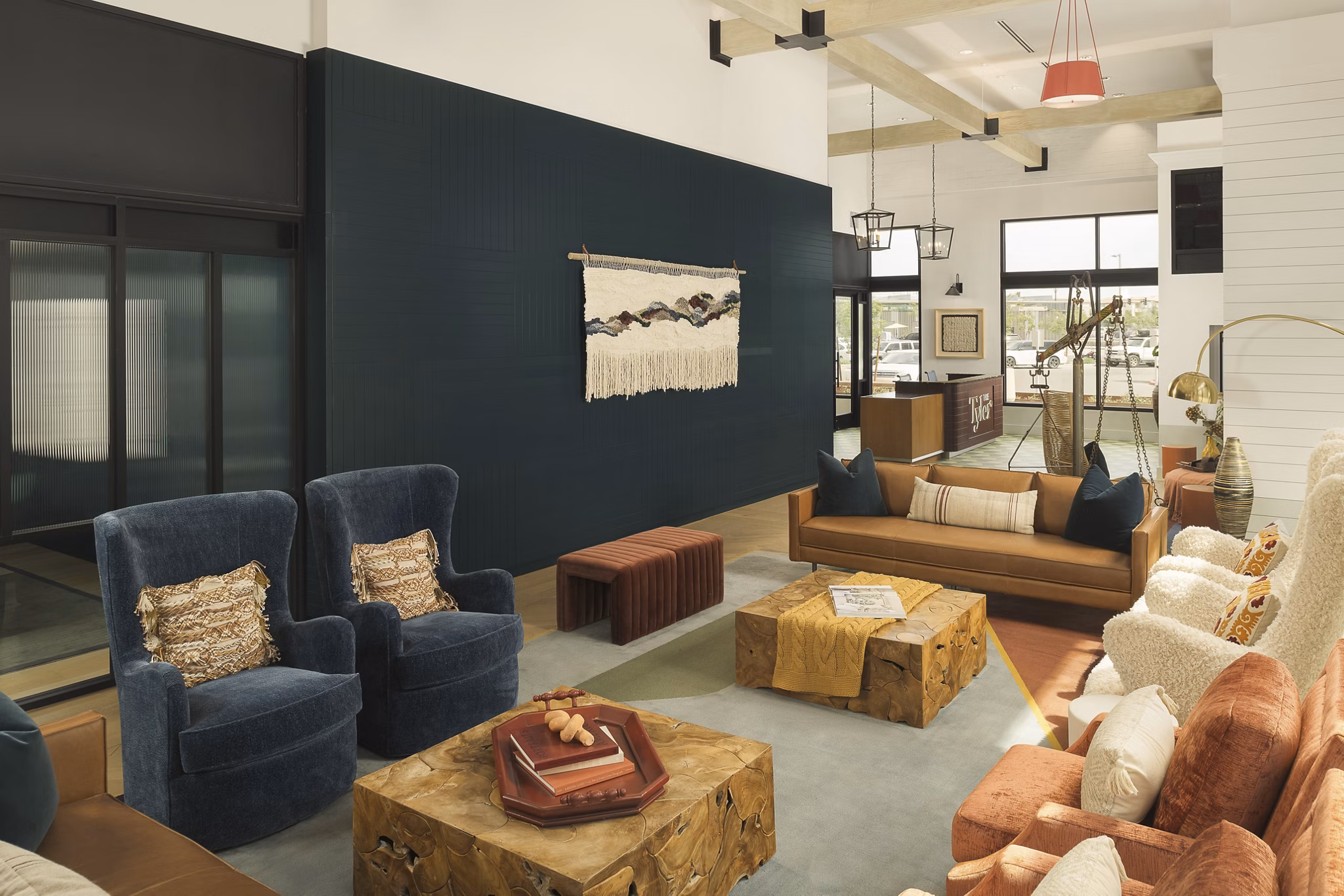 Chic clubhouse with modern seating and decor at The Tyler Apartments in  community