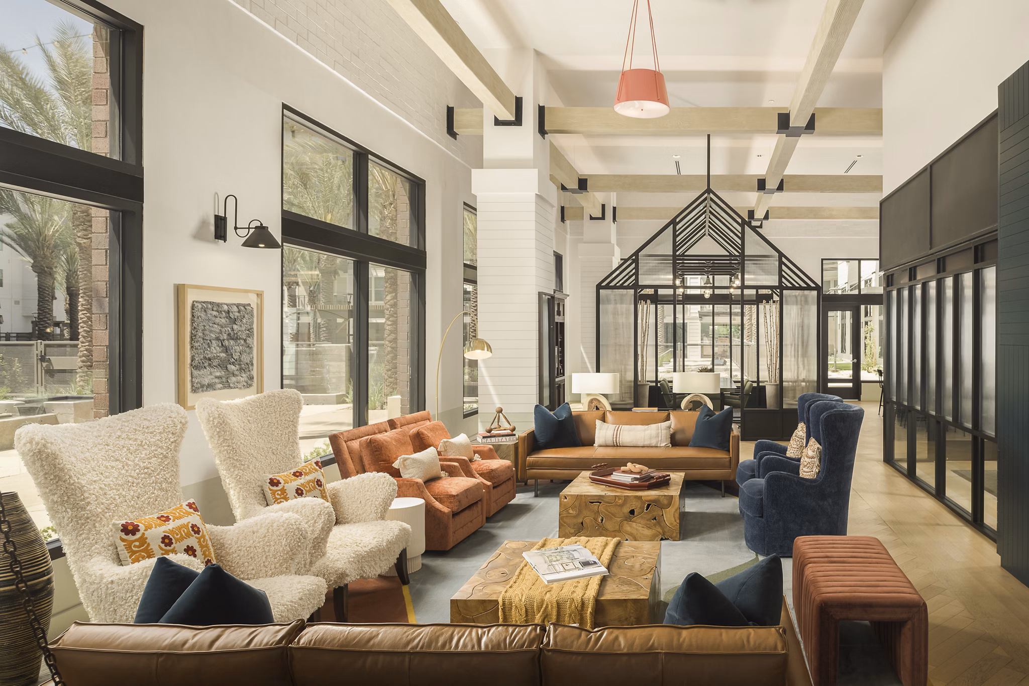 Clubhouse featuring modern design and seating areas at The Tyler Apartments, luxury living by Greystar