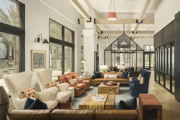 Clubhouse featuring modern design and seating areas at The Tyler Apartments, luxury living by Greystar