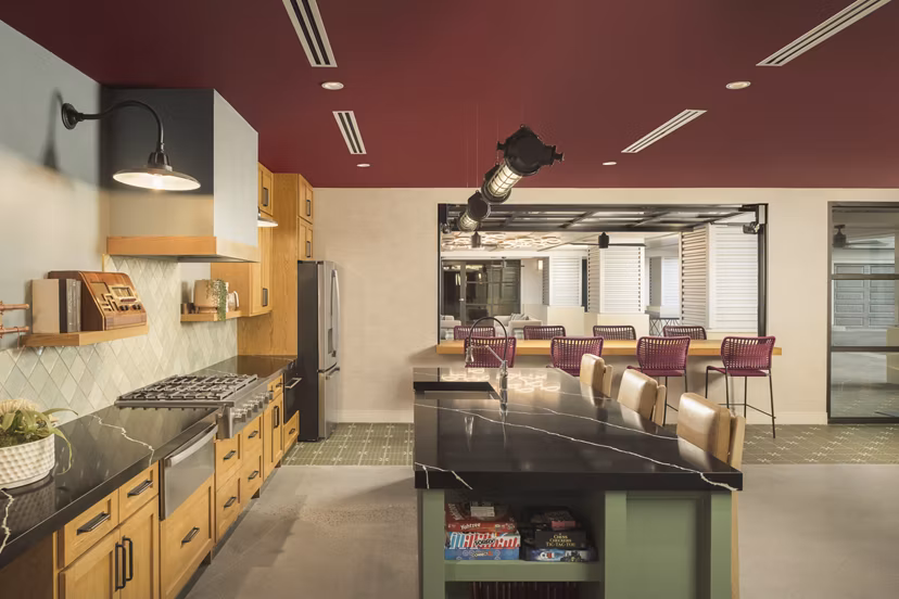 Clubhouse featuring modern design and entertainment space at The Tyler Apartments