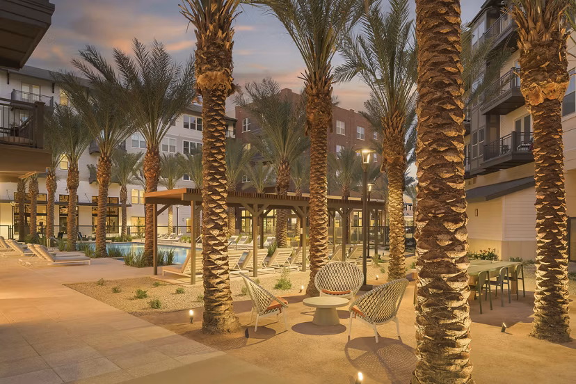 Charming courtyard with landscaped gardens at The Tyler Apartments, showcasing modern luxury living