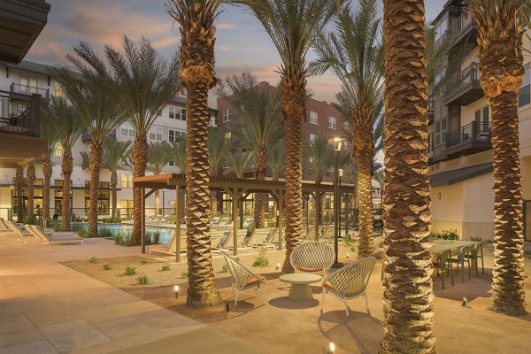 Charming courtyard with landscaped gardens at The Tyler Apartments, showcasing modern luxury living