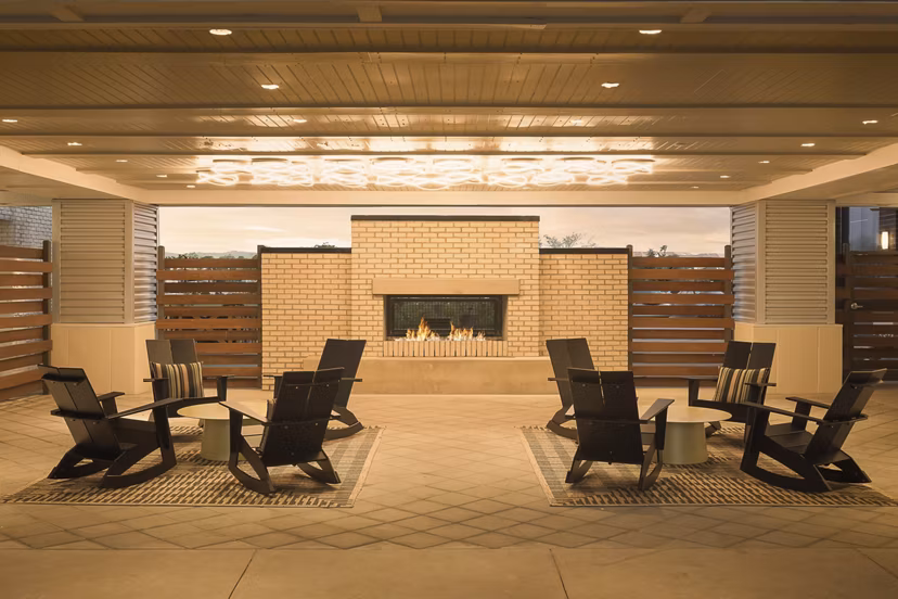 Fire pit with cozy seating area at The Tyler Apartments, offering luxury amenities in a serene setting