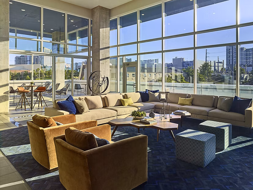 Clubhouse with modern design elements at Generation Atlanta Apartments, featuring luxury amenities for resident gatherings and events