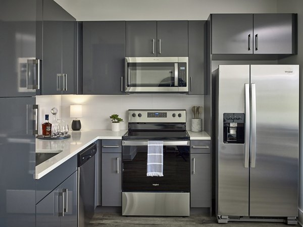 Modern kitchen with stainless steel appliances at Generation Atlanta Apartments