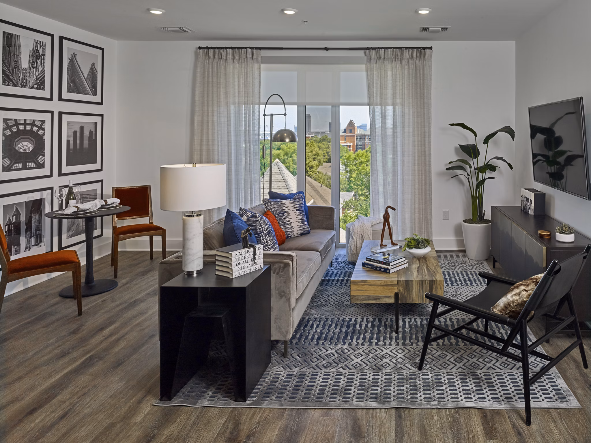 Modern living room with floor-to-ceiling windows at Generation Atlanta Apartments