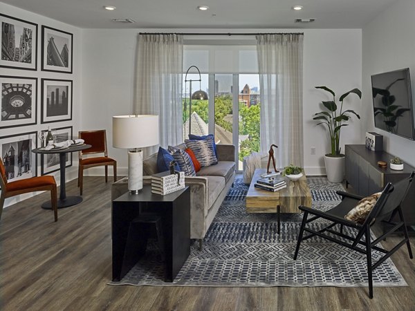 Modern living room with floor-to-ceiling windows at Generation Atlanta Apartments