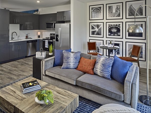 Spacious living room with modern decor and city views at Generation Atlanta Apartments