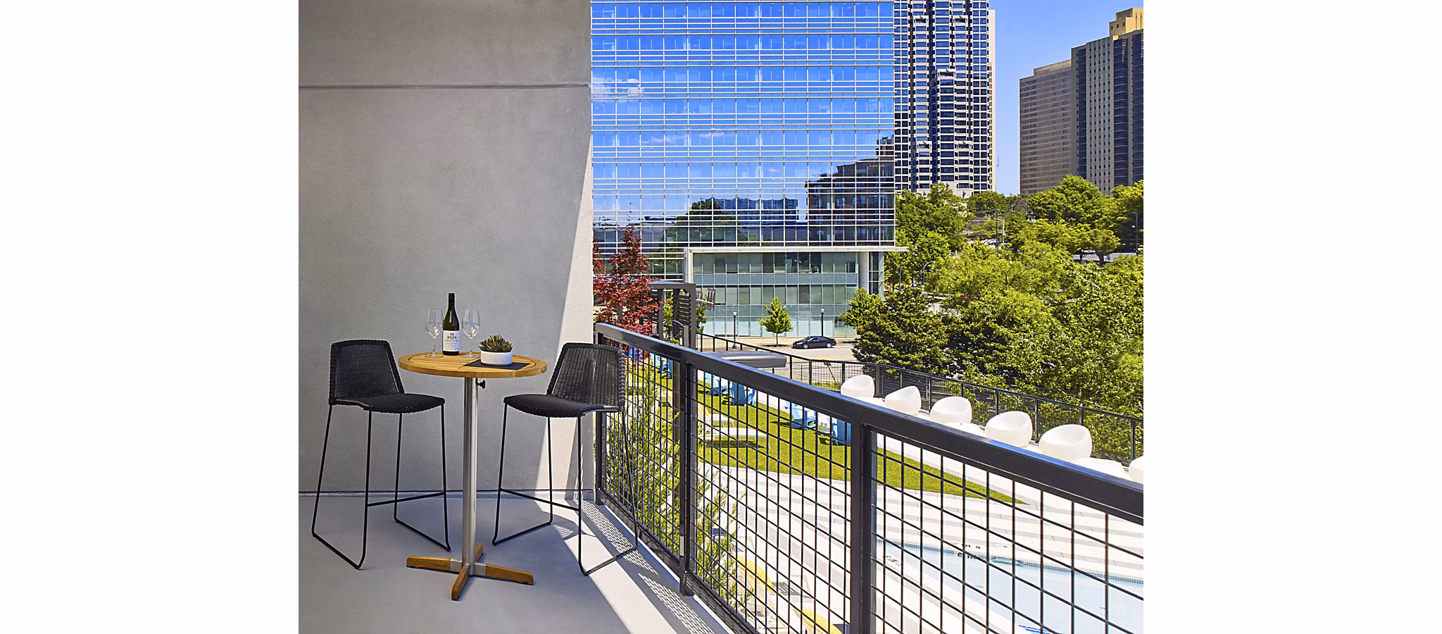 Patio with stylish outdoor seating and skyline views at Generation Atlanta Apartments
