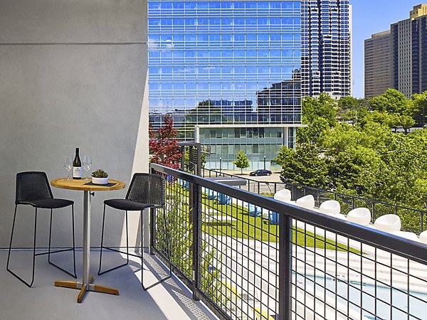 Patio with stylish outdoor seating and skyline views at Generation Atlanta Apartments