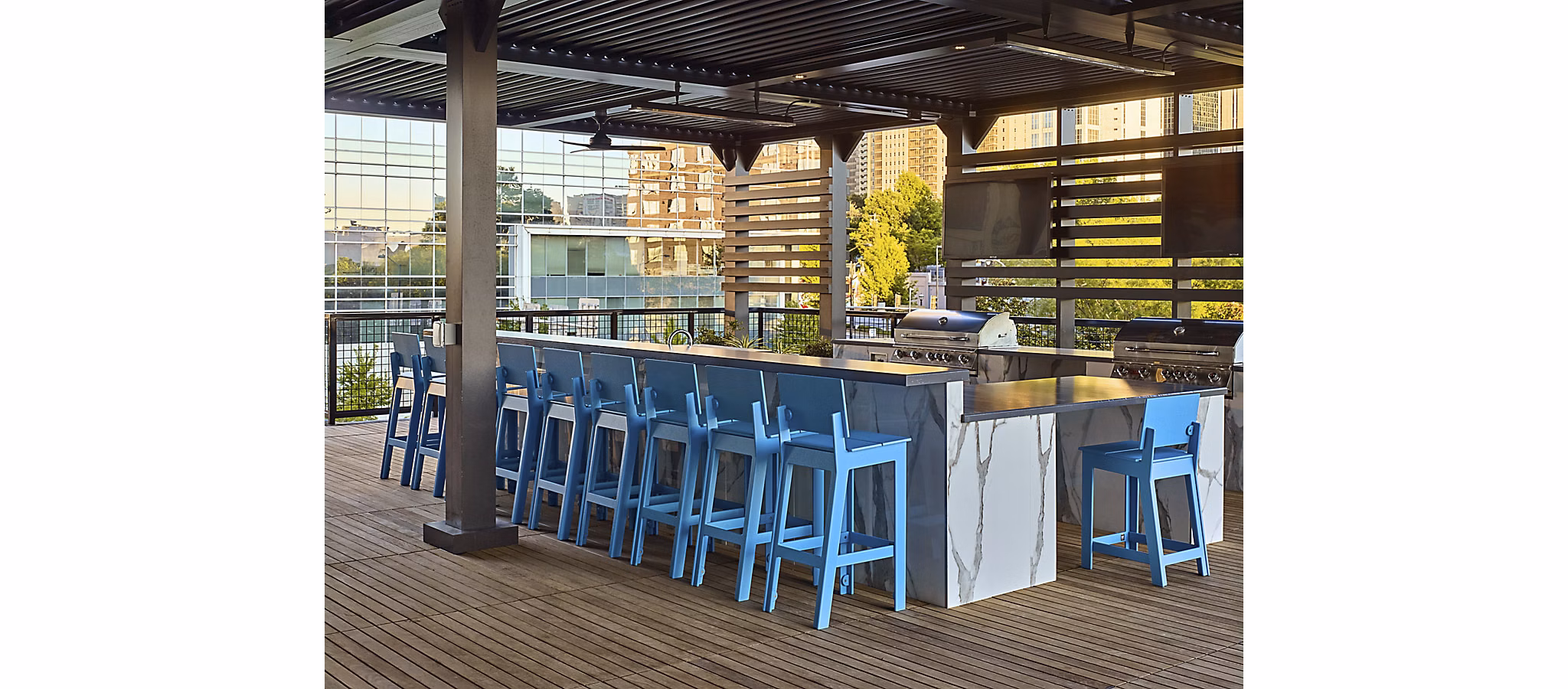 Grill station with seating area at Generation Atlanta Apartments, perfect for outdoor gatherings and barbecues