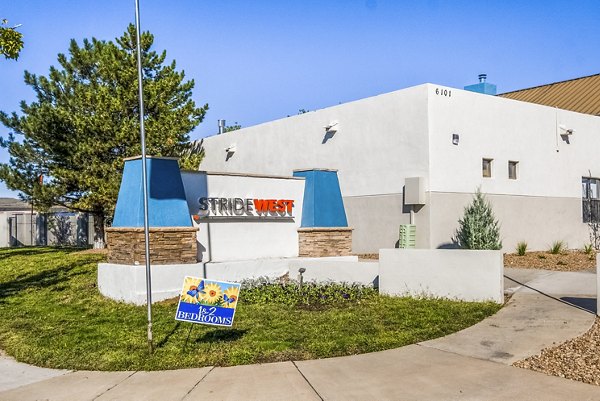 Stride West Apartments: Elegant signage on building showcasing luxury apartments in vibrant neighborhood