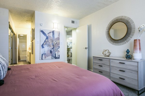 Tranquil bedroom with contemporary furnishings at Stride West Apartments, perfect for luxury living in a serene setting