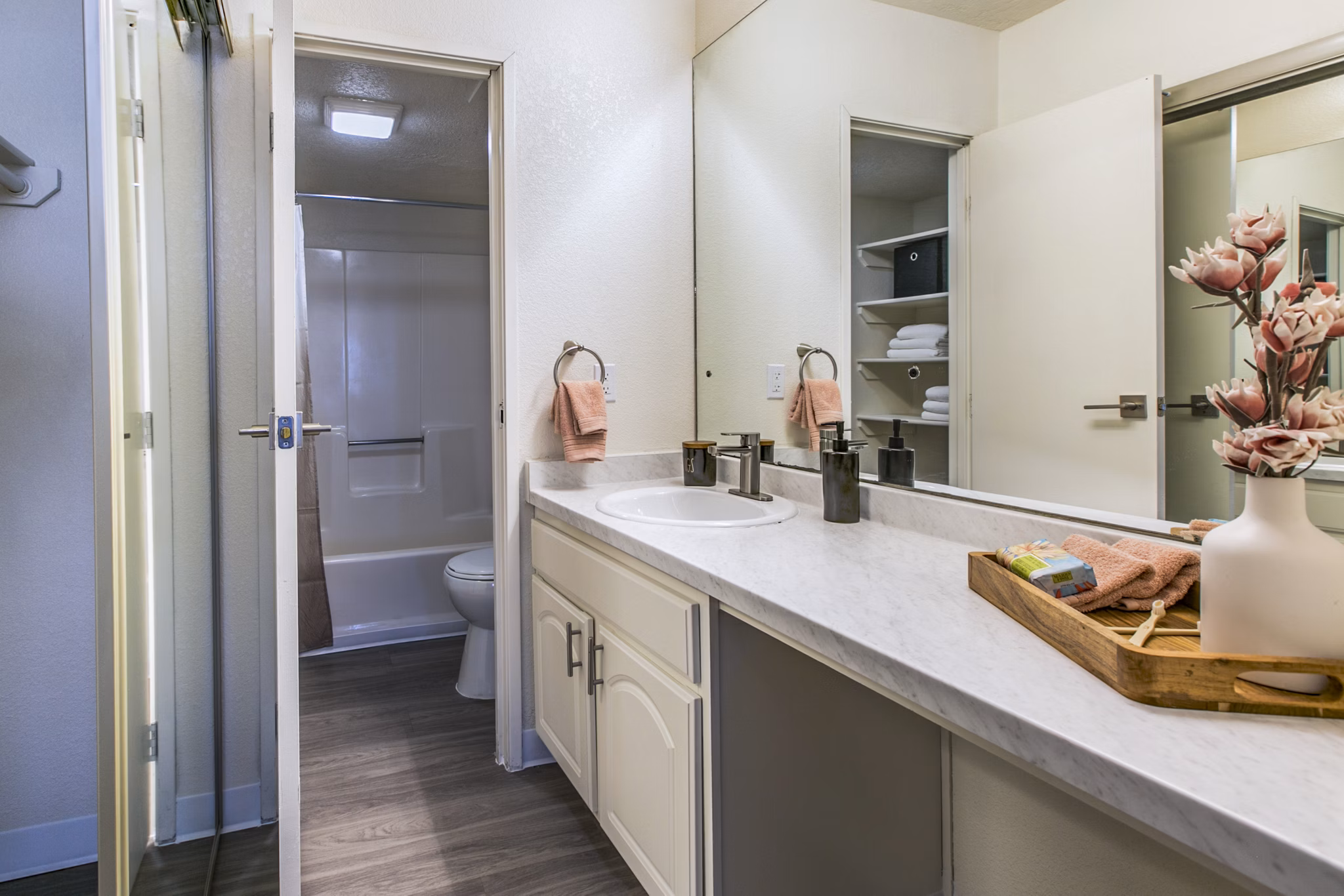 Modern bathroom with sleek fixtures and ample lighting at Stride West Apartments
