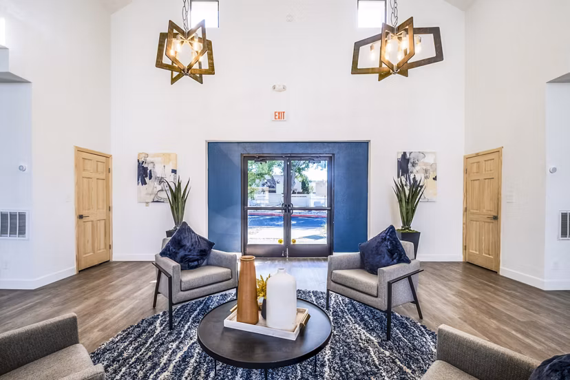 Clubhouse featuring modern design and communal seating at Stride West Apartments