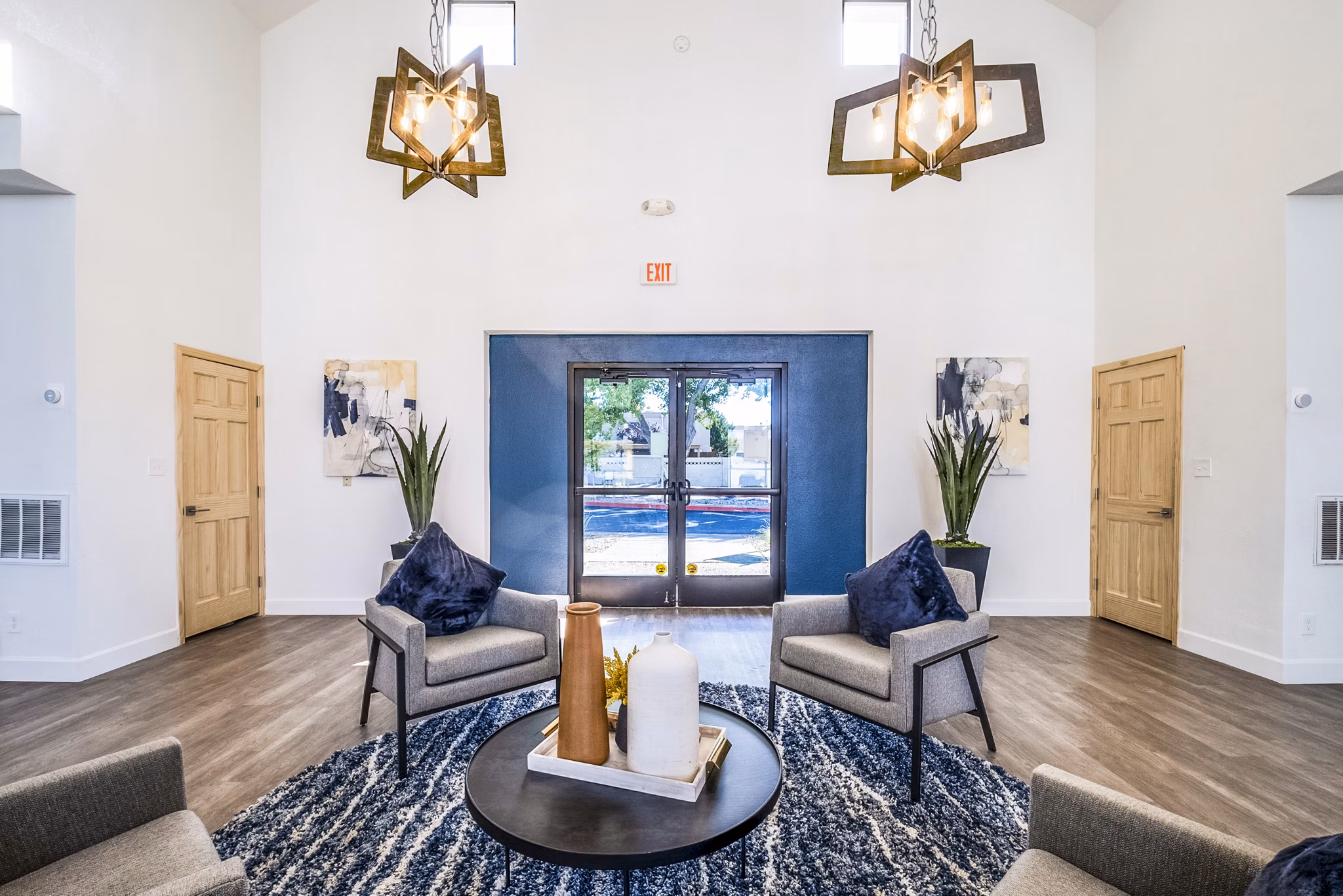 Clubhouse featuring modern design and communal seating at Stride West Apartments