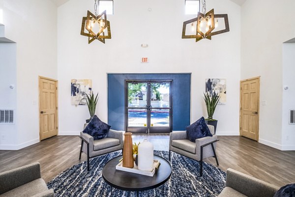 Clubhouse featuring modern design and communal seating at Stride West Apartments