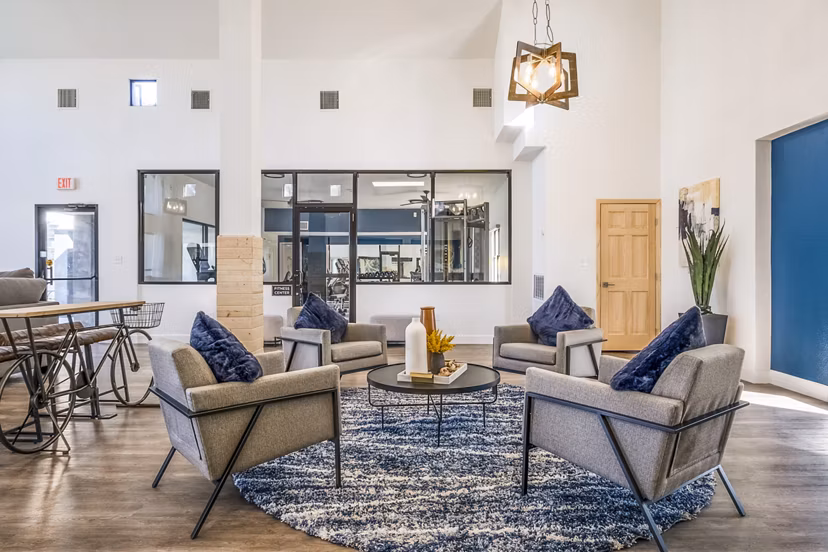 Clubhouse featuring modern design and ample seating at Stride West Apartments, a luxury community by Greystar