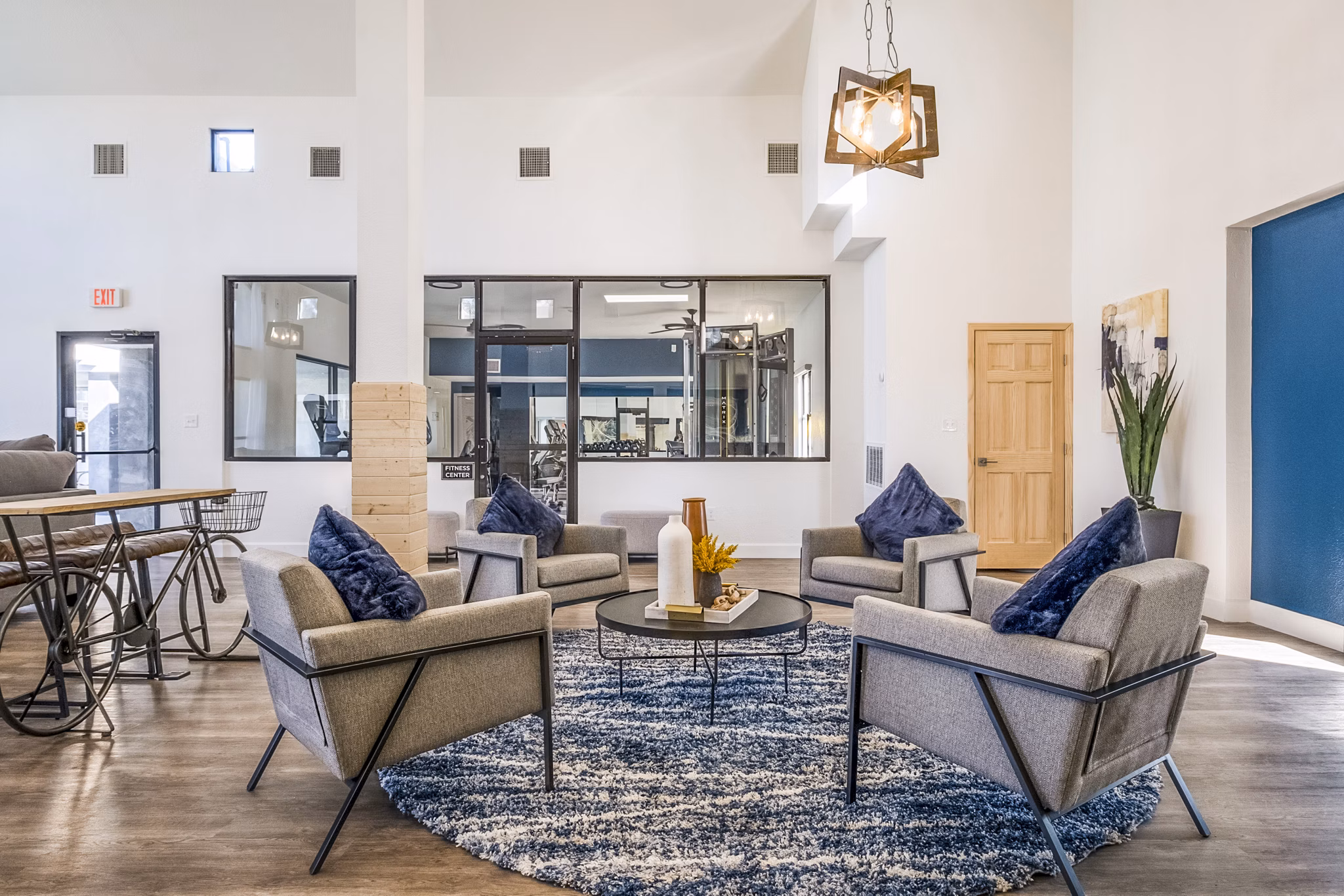 Clubhouse featuring modern design and ample seating at Stride West Apartments, a luxury community by Greystar