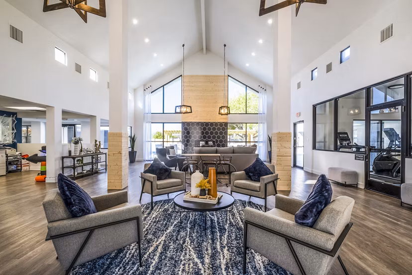 Modern clubhouse with cozy seating and entertainment area at Stride West Apartments