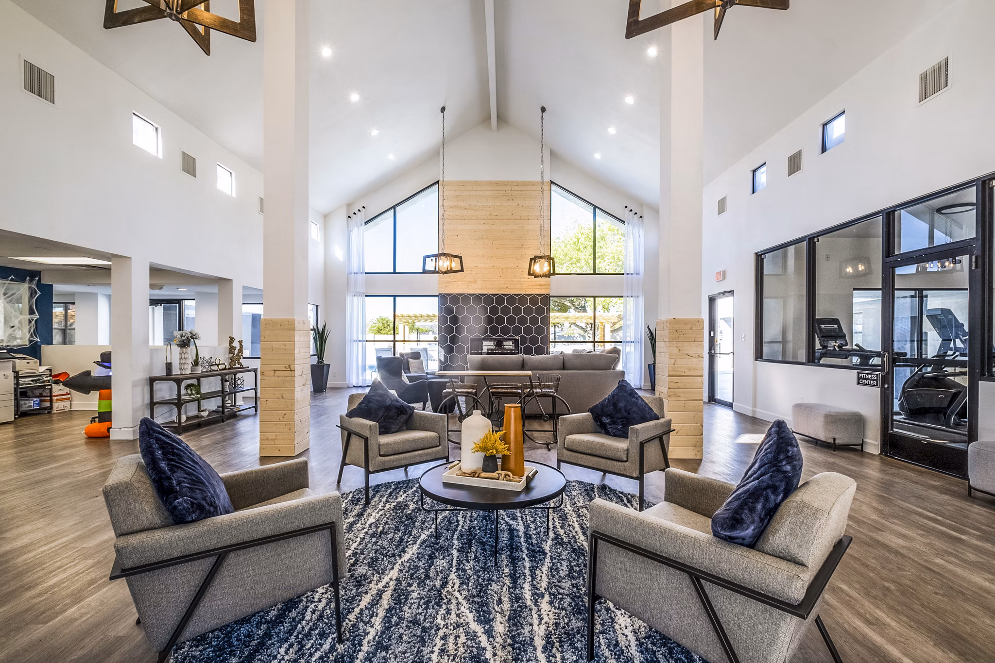 Modern clubhouse with cozy seating and entertainment area at Stride West Apartments