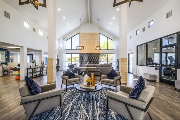 Modern clubhouse with cozy seating and entertainment area at Stride West Apartments