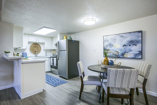 Dining room featuring modern table set and chic lighting in Stride West Apartments, San Diego