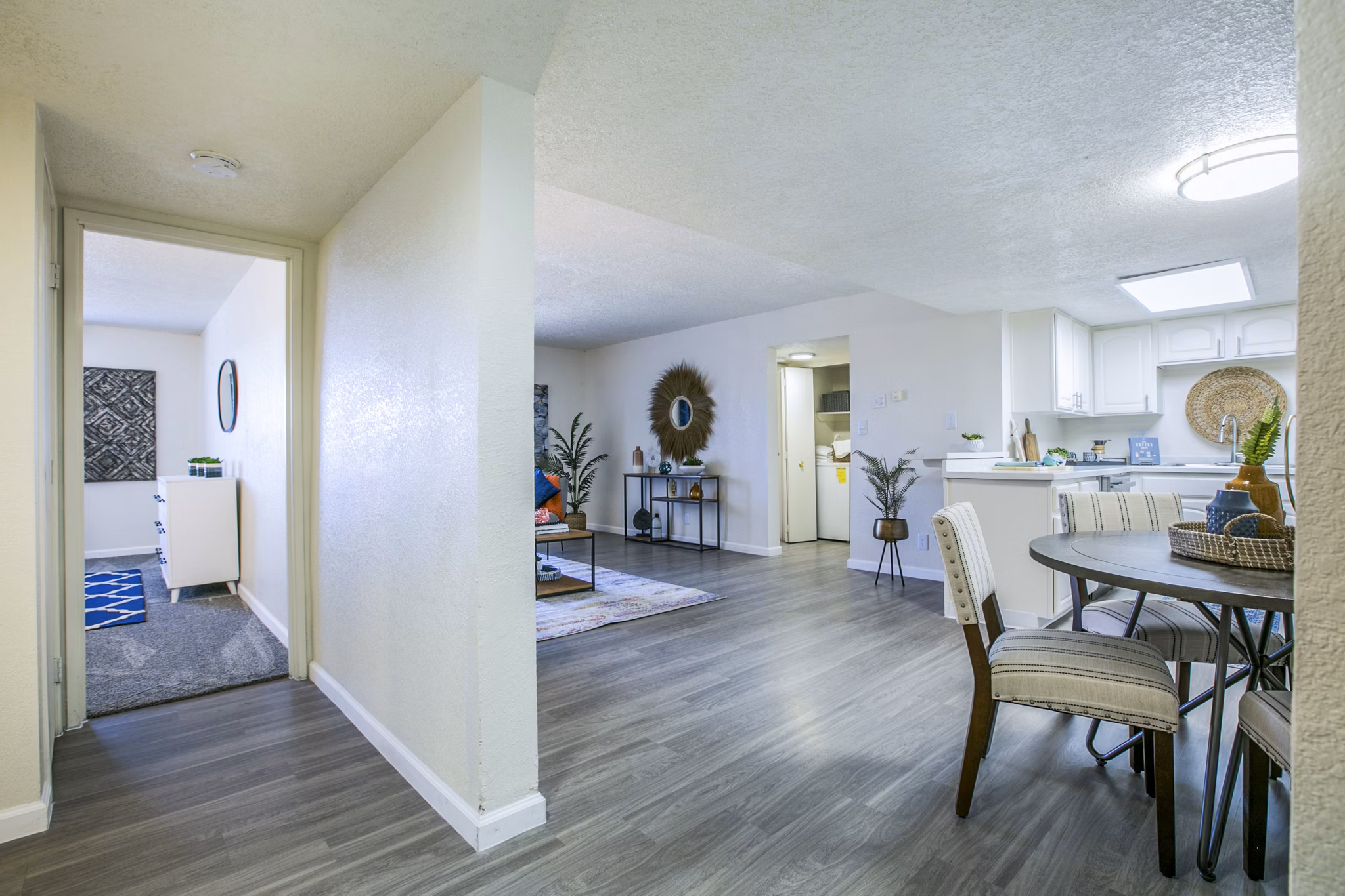 Dining room with elegant modern dÃ©cor at Stride West Apartments featuring sleek furniture and stylish lighting
