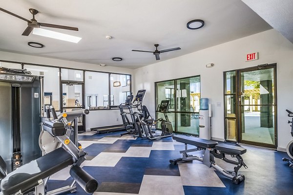 Fitness center with modern equipment at Stride West Apartments, perfect for an active lifestyle