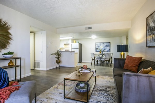 Bright living room with modern decor at Stride West Apartments, perfect for luxury living in a Greystar community