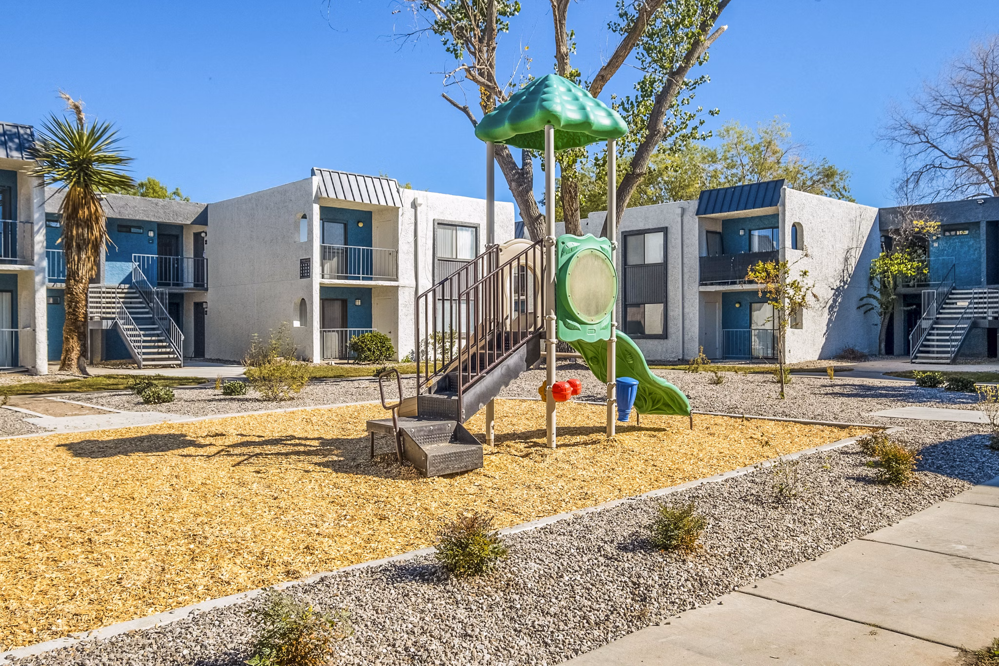 Playground with modern equipment at Stride West Apartment in a vibrant community offering luxury living