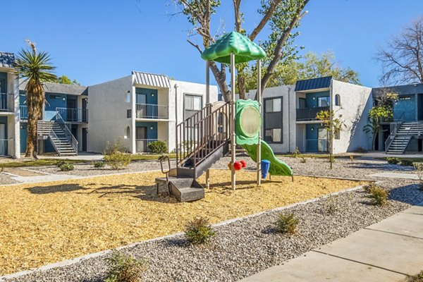 Playground with modern equipment at Stride West Apartment in a vibrant community offering luxury living