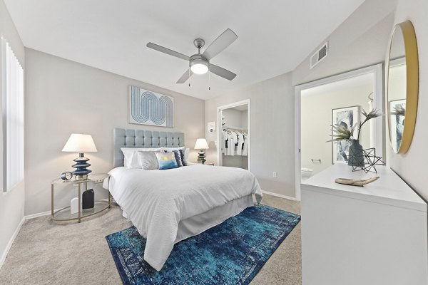 Elegant bedroom with modern decor and large windows at Morada Grande Apartments