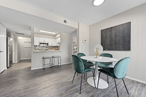 Dining area with stylish furnishings and modern lighting at Morada Grande Apartments