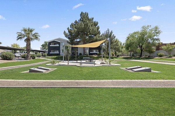 Modern courtyard with lush landscaping at Morada Grande Apartments, featuring comfortable seating areas for relaxation and social gatherings