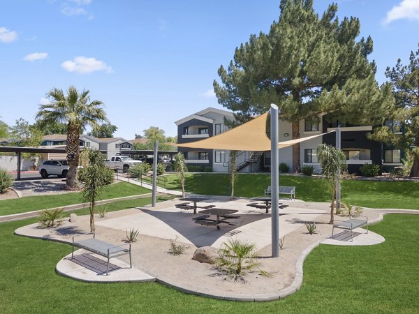 Morada Grande Apartments: Serene courtyard with lush greenery and seating areas, perfect for relaxation and social gatherings