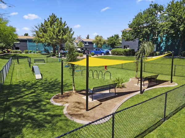 Spacious dog park featuring agility equipment at Morada Grande Apartments, perfect for residents and their pets to enjoy the outdoors