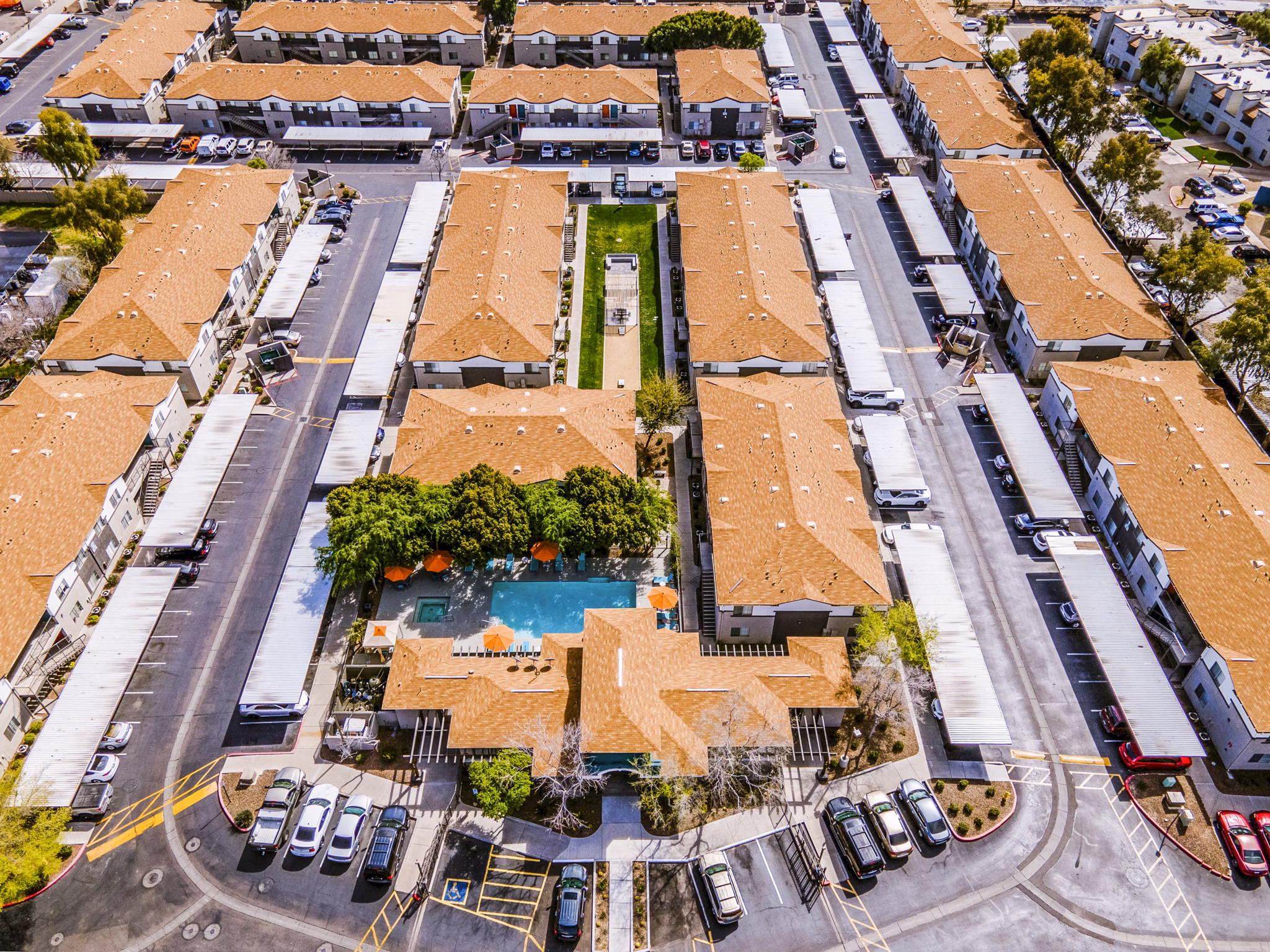 Morada Sky Apartments: Luxurious building with inviting pool in vibrant city setting