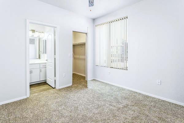 Cozy bedroom with contemporary decor at The Urban Apartments, Greystar's luxury living destination