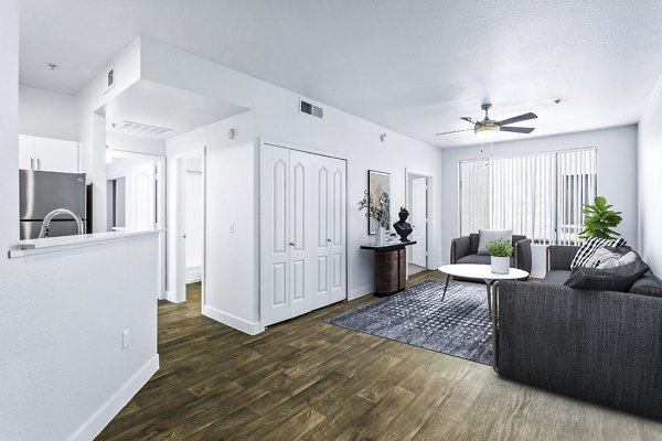 Spacious living room with sleek modern furnishings at The Urban Apartments, offering luxury apartment living in the heart of the city