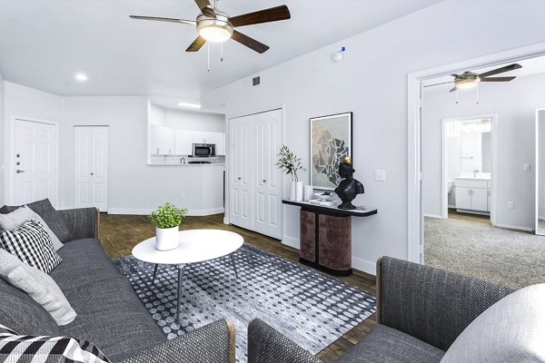 Modern living room with elegant furnishings at The Urban Apartments, featuring contemporary design elements for a luxurious experience