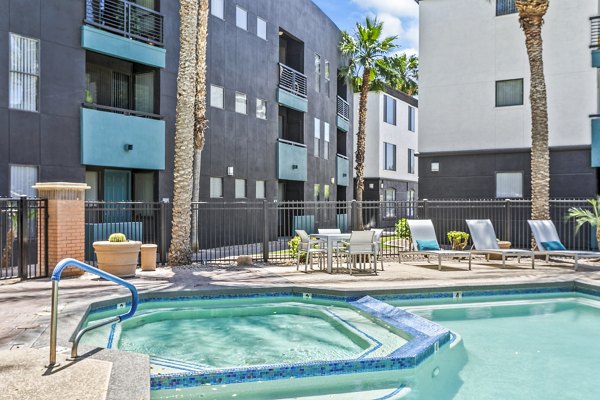 Rooftop pool at The Urban Apartments featuring panoramic skyline views